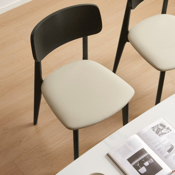 Andover Minimalist Black Dining Chair with Curved Backrest and Solid Wood Legs