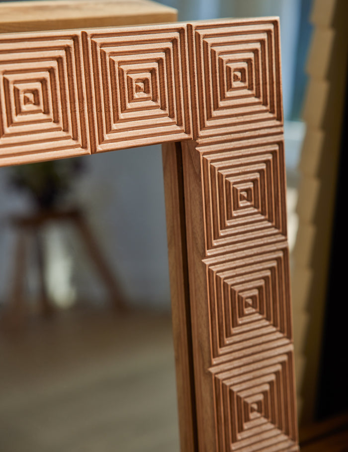 #color::natural | Corner of the Chelan handcrafted carved wood frame mirror.