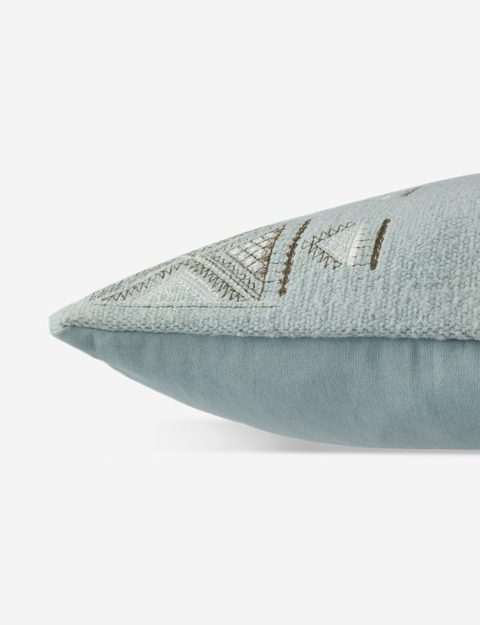 #color::blue #insert::down #insert::polyester | Side view of the Ciecil sky blue throw pillow with an arabesque pattern and a woven cotton front