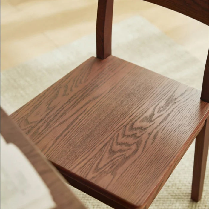 Edele Walnut Color Solid Timber Dining Chair with Subtle Curved Backrest
