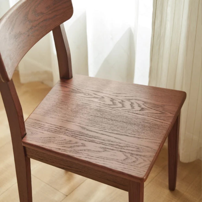 Edele Walnut Color Solid Timber Dining Chair with Subtle Curved Backrest