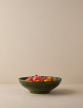 #color::green | Peony green textural terracotta decorative bowl by Heidi Caillier filled with skin on fruit.