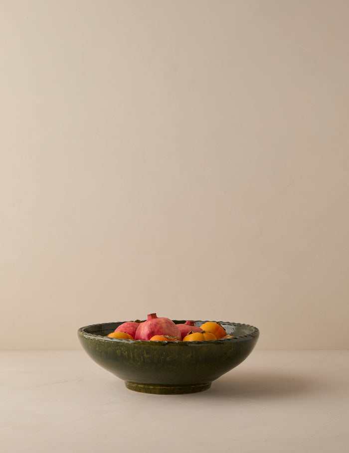 #color::green | Peony green textural terracotta decorative bowl by Heidi Caillier filled with skin on fruit.